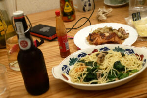 Pasta and beer on the wooden table