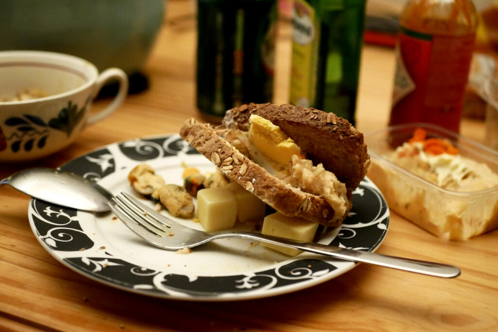 sandwich with fork and spoon on the plate