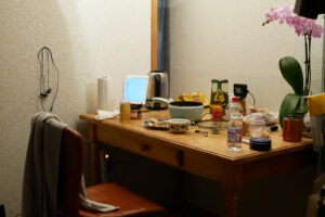 View of my desk, there are flowers, hotpot, and iPad