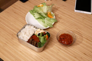 Hamburg Bento lunch box on the wooden table