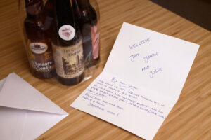 bottle of Local brewery beers and a message card on the table