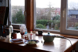 View from the window side. Dishes on the table