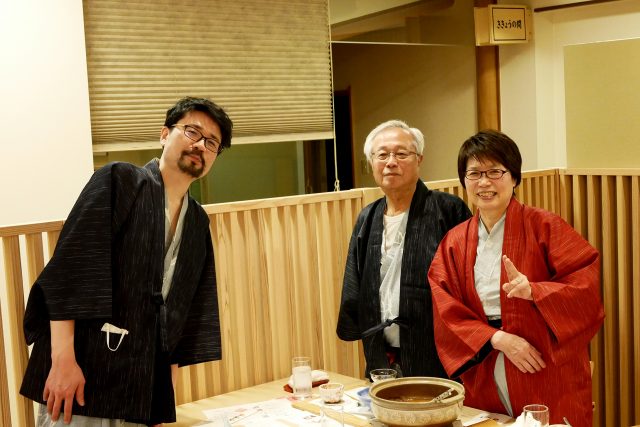 A middle aged man and his old parents at Japanese onsen ryokan in Yamaguchi