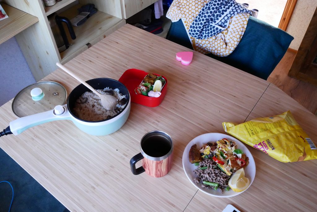 Cooking bento on the table, there are hot pot, snacks