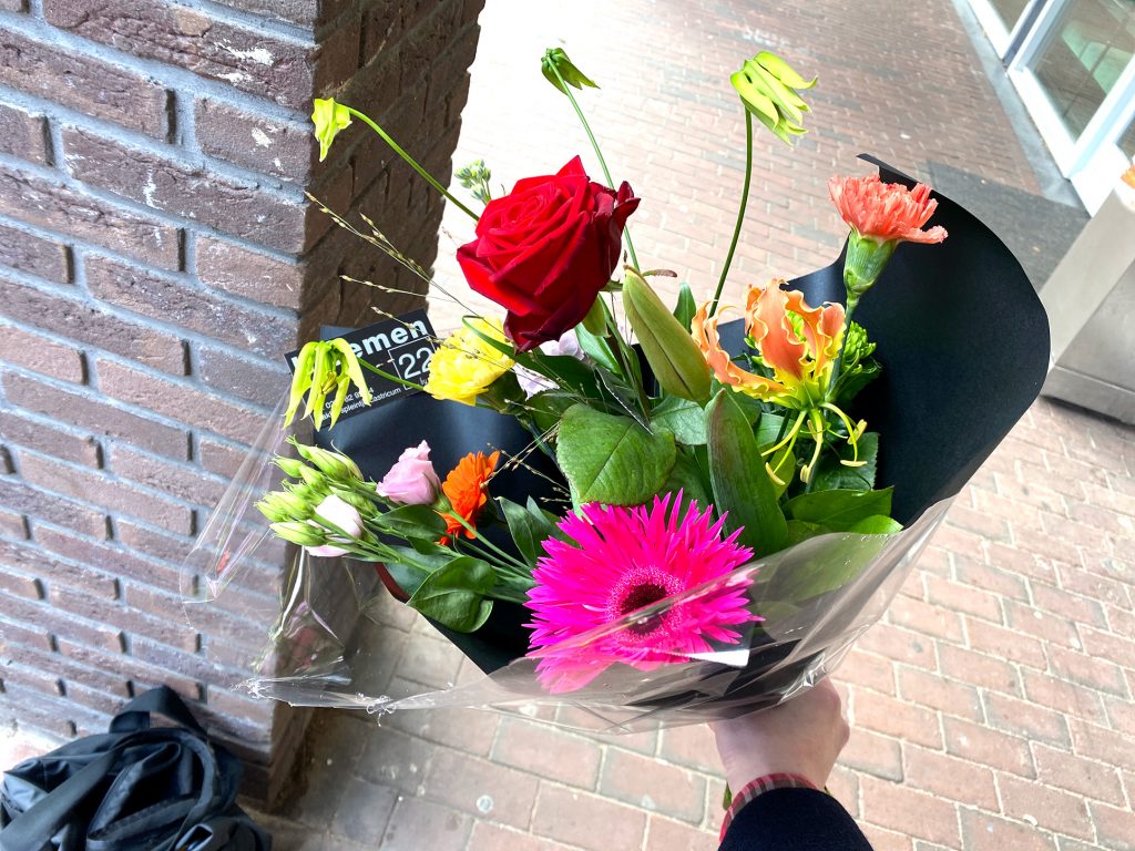 A ma has Flowers on the street in the Netherlands