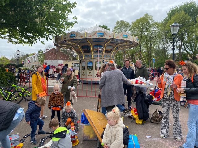 Kings day in the Netherlands, there are people and looks like an amusement park