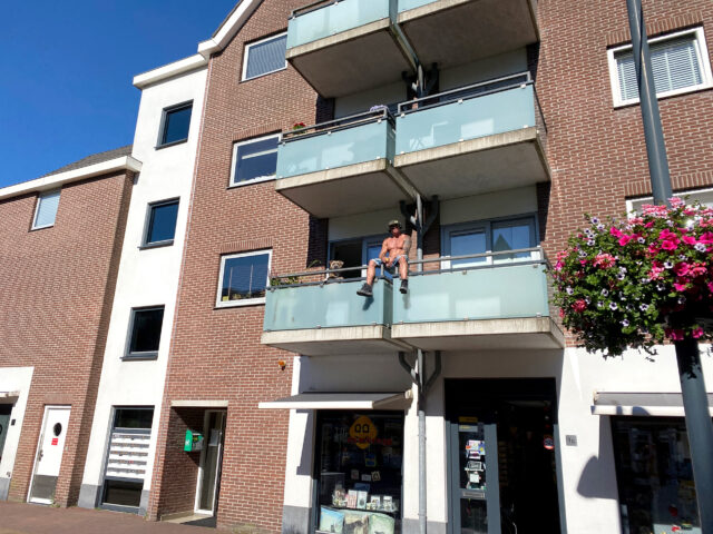 A man sitting balcony in the Netherlands