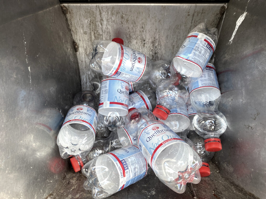 fizzy water bottles in the garbage collection box