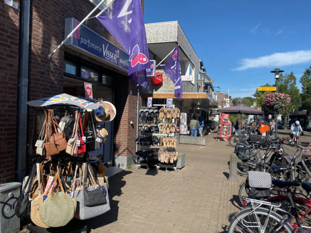 Selling bags and shoes, bicycles, View of Castricum village in the Netherlands