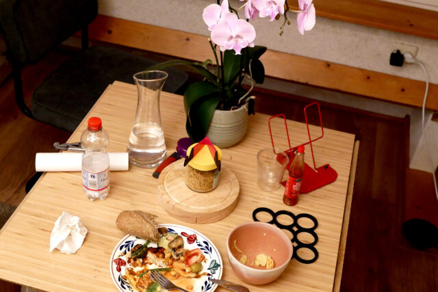 Orchid, eating dinner on the wooden table