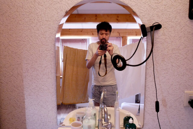 a Japanese man in the mirror