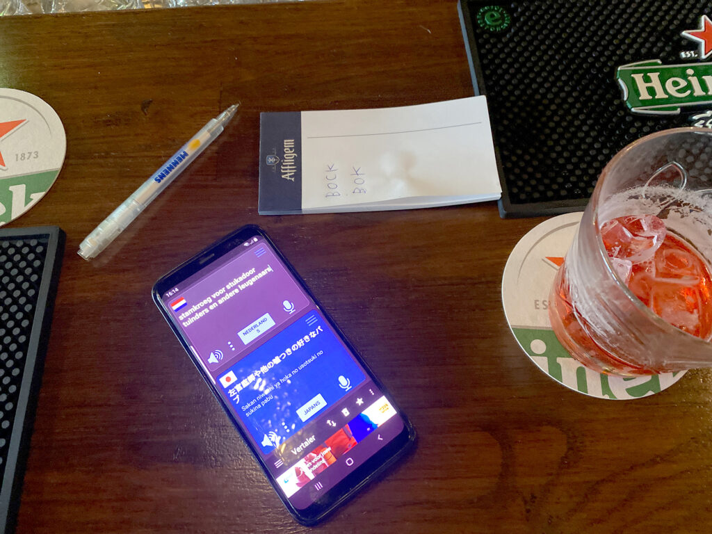mobile phone and liquior on the bar table
