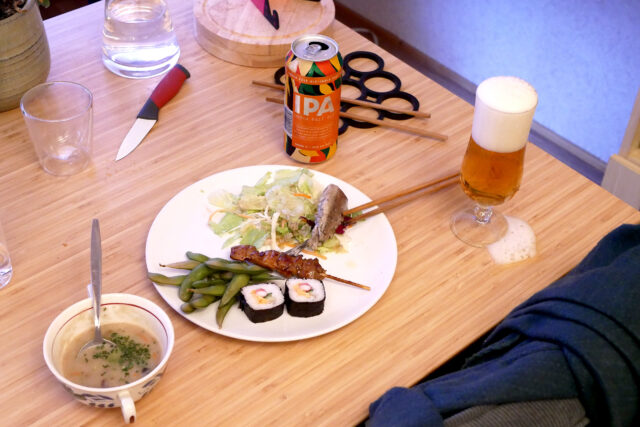 sushi yakitori on the plate and ipa beer