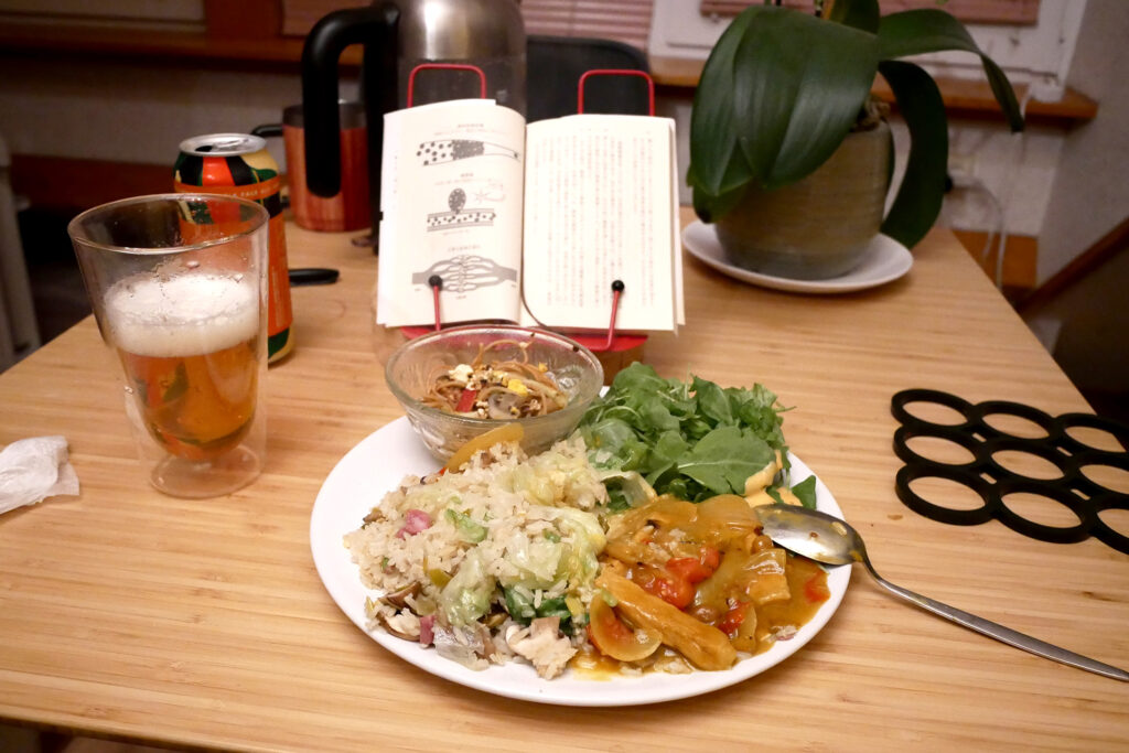 fried rice with curry ipa beer and book on the table