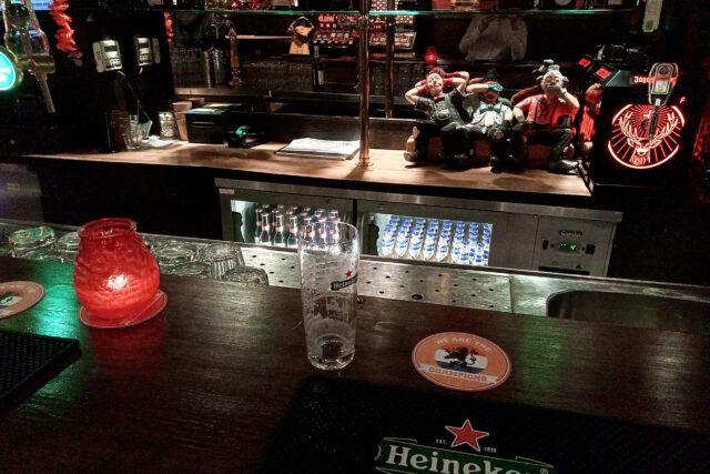 view from the bar counter heineken beer glass