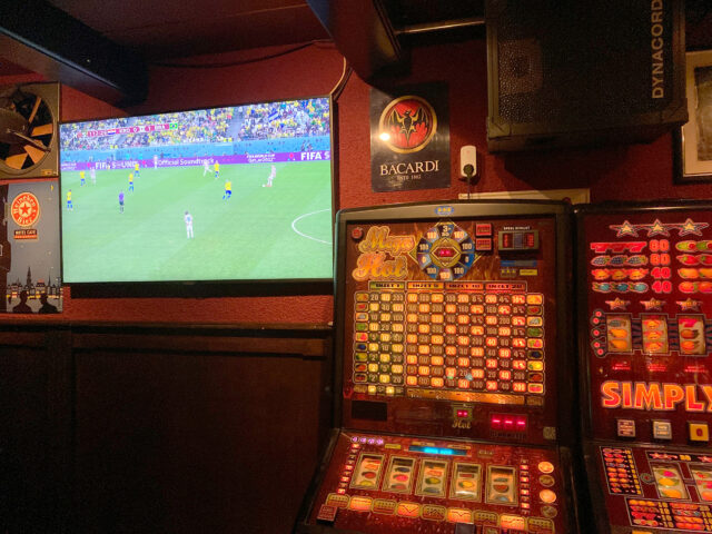 ganbling machine and tv showed football game